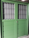 Puerta doble hoja chapa 18 de 162x205 1/2 reja